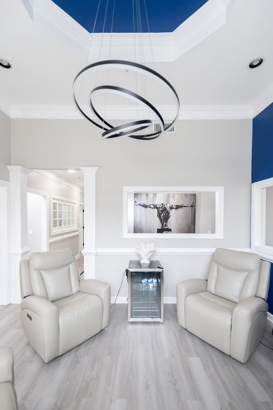 THRIVE Peak Performance reception lounge with premium leather chairs and chandelier