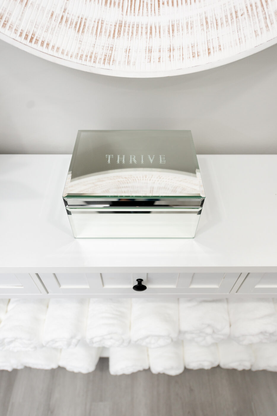 THRIVE branded mirrored box and clinic details at THRIVE Peak Performance Alpharetta